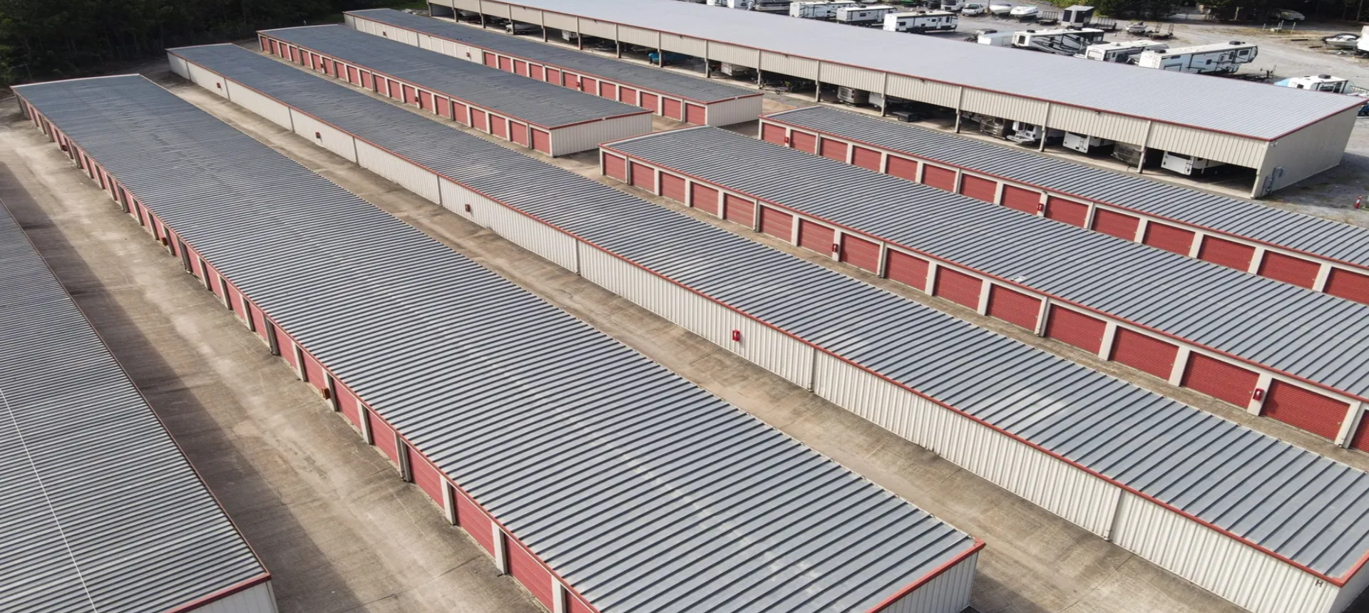 A lot of storage units in a parking lot.